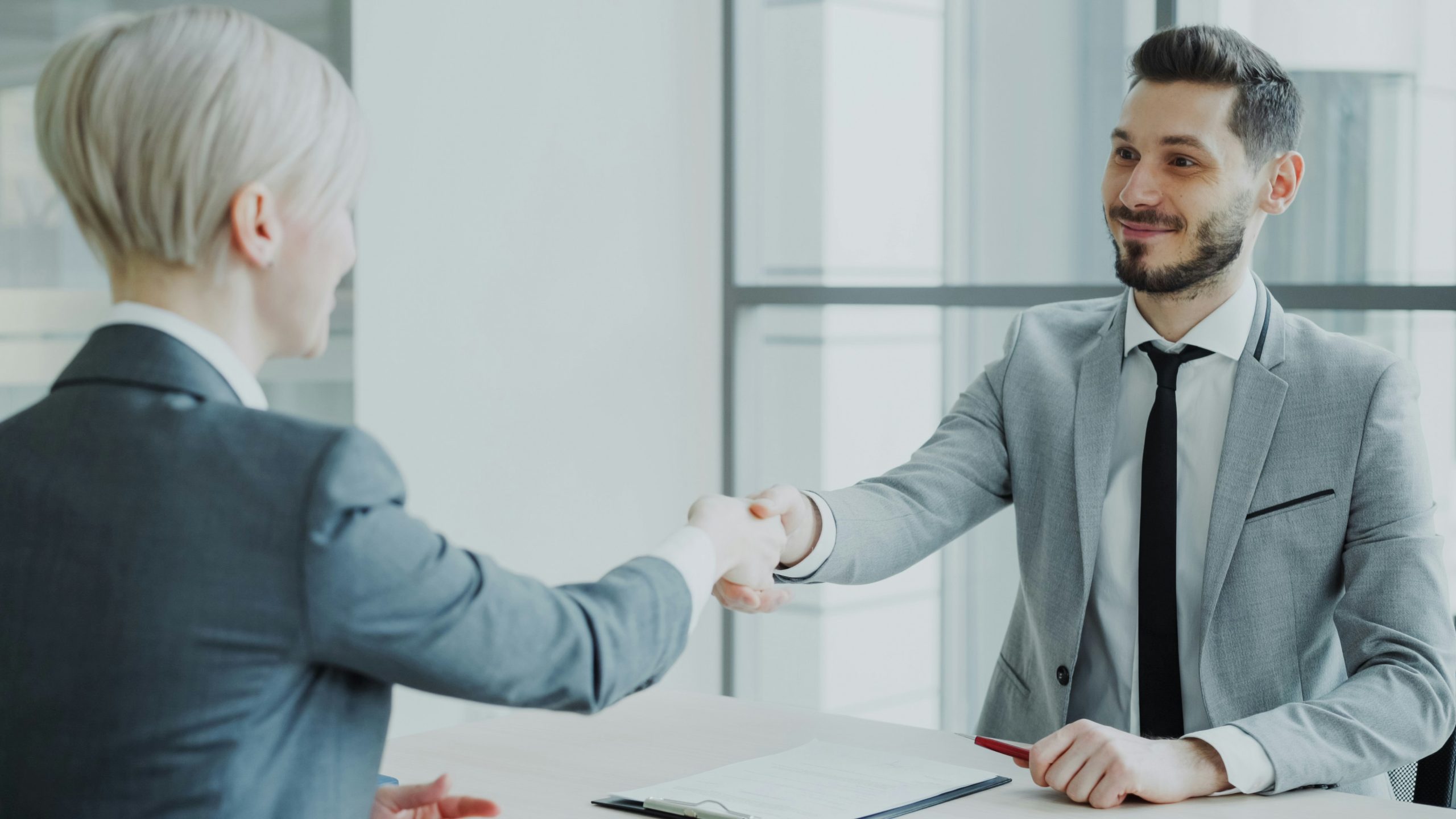 insurance agent and client shaking hands